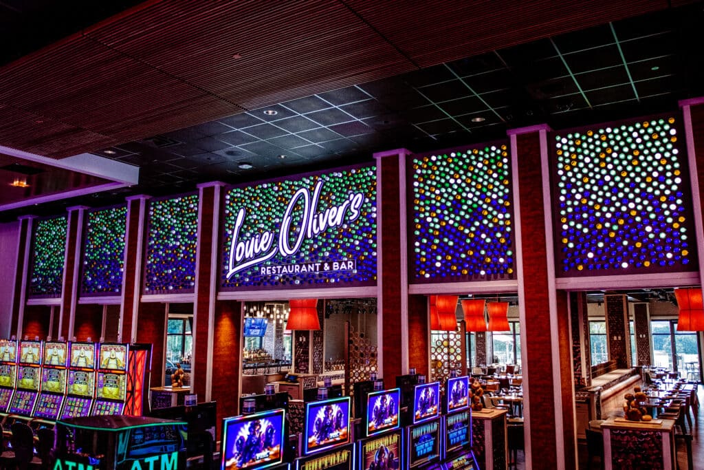 Louie Oliver's Signage at Harrah's Northern California with Unique Custom Glass Bottle Wall
