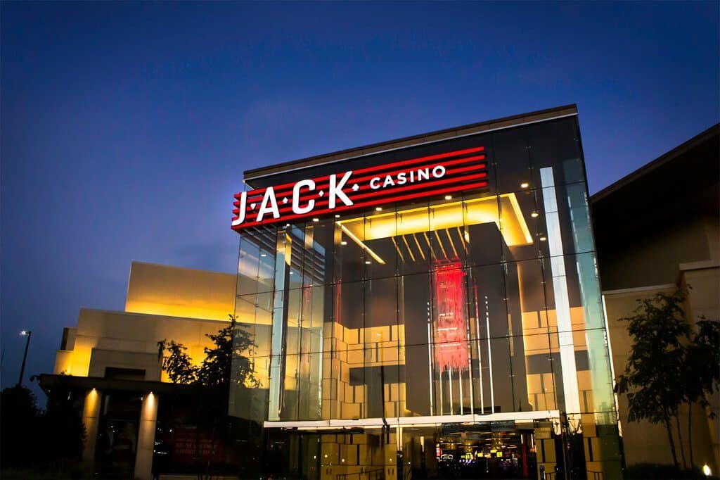 JACK Casino entrance at dusk with illuminated architectural signage and branded hospitality graphics by Gable.
