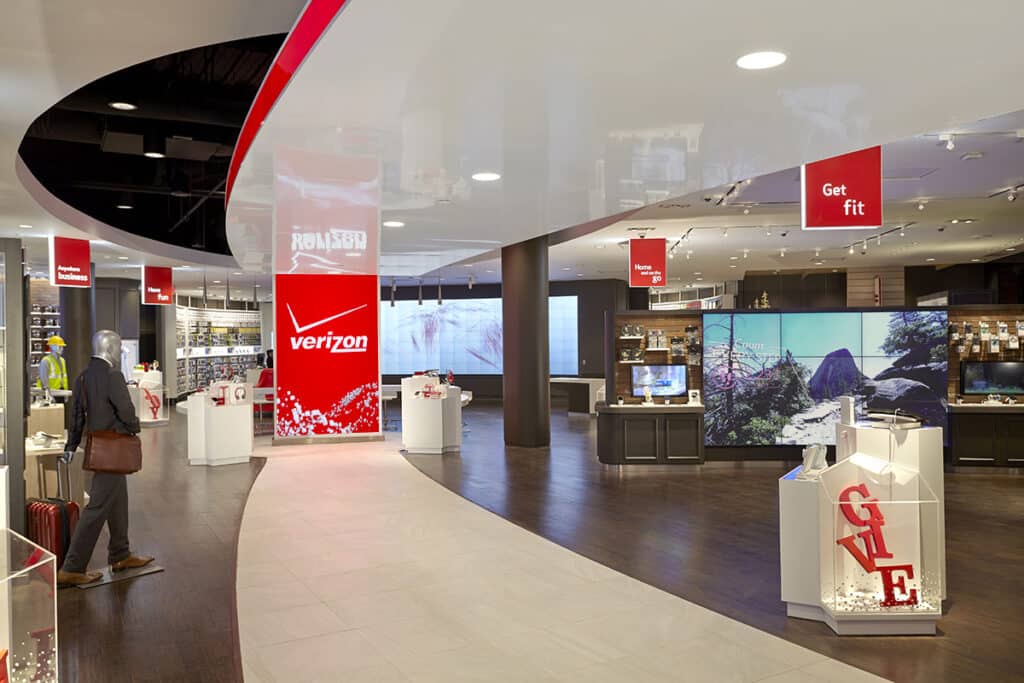 Verizon retail store interior with branded environmental graphics, digital displays, and customer experience signage by Gable.