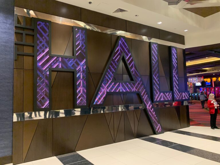 LED letters in aluminum frames shaped as The Hall wordmark displaying animated content for The Hall At Live! Casino