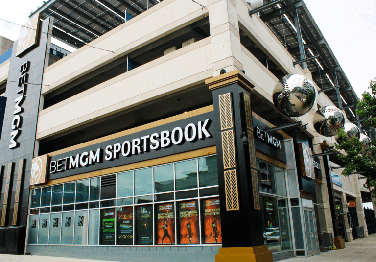 Exterior BetMGM Sportsbook illuminated channel letters, architectural accent panels, semi-transparent LED window mesh displays