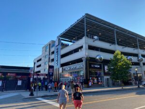 Exterior brand identity signs, digital displays, and architectural elements at the BetMGM Sportsbook at Nationals Park