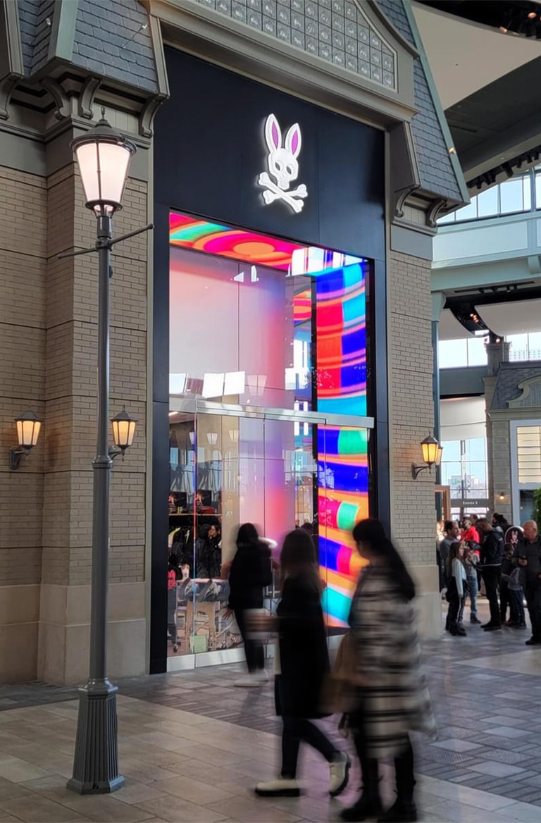 Psycho Bunny retail store in Montreal Canada with a digital entrance.