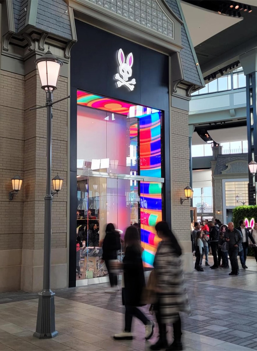 Psycho Bunny retail store in Montreal Canada with a digital signage entrance.