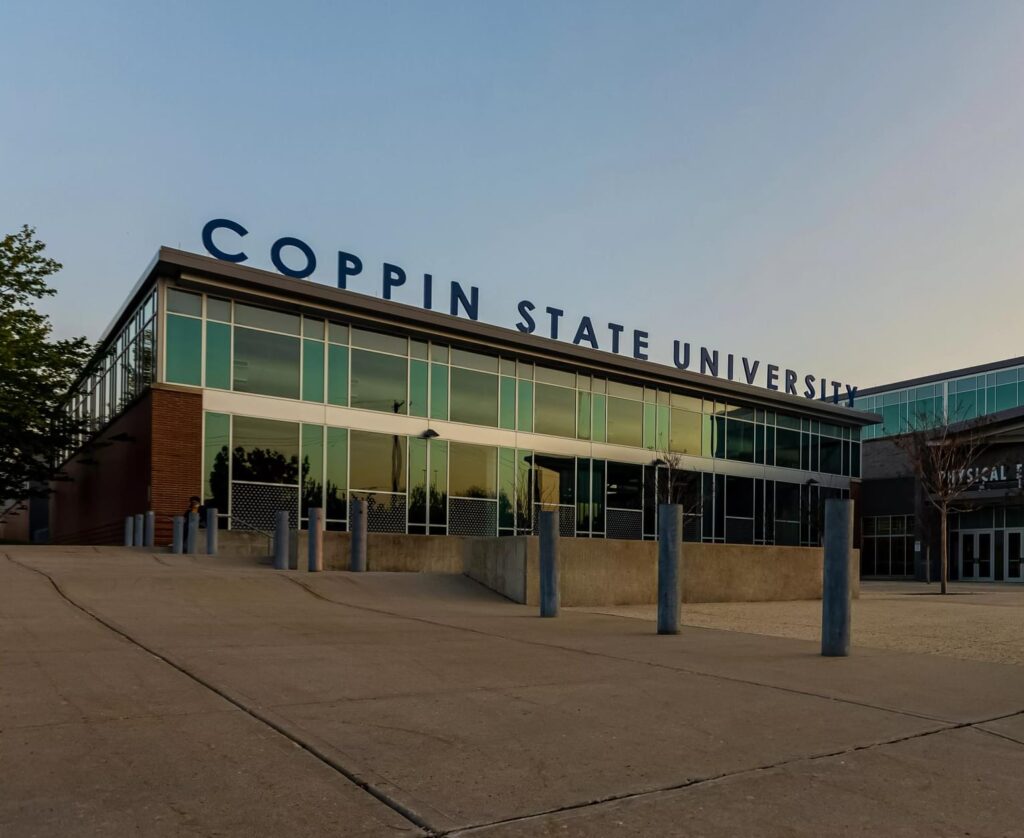 Coppin State University building with large university letters on top of building.