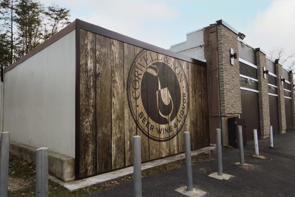 Corwell’s side wall logo graphic featuring large-scale exterior branding and environmental graphics by Gable.