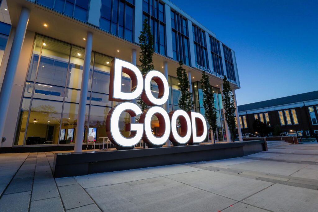 DO GOOD LED sign at night outside of a campus building at the University of Maryland.
