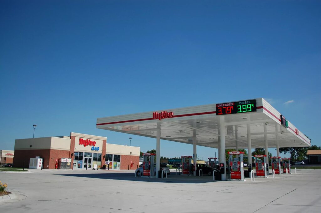 Hyvee forecourt gas station with storefront letters and digital gas price changer.