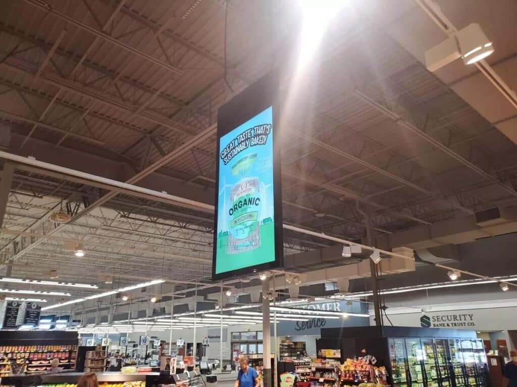 Hanging Poster for Retail Media Network at a Neptune Retail Solutions Location