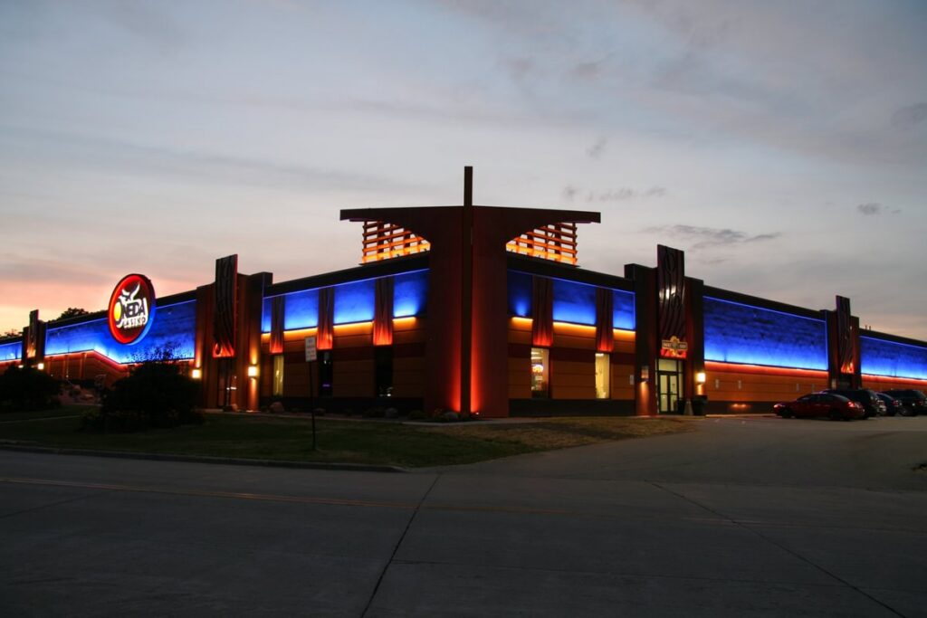 Oneida Casino building exterior at dusk featuring large-scale illuminated signage and visual communications by Gable.