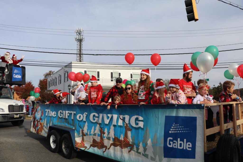 Gable team members in a parade float for a community program