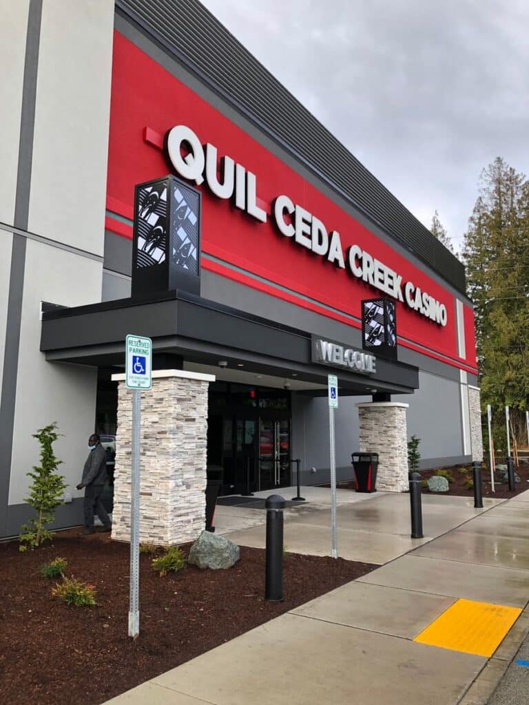 Quil Ceda Creek Casino exterior entrance with bold illuminated branding on the modern facade.