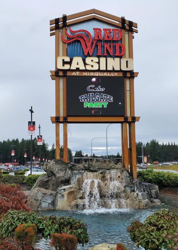 Red Wind Casino at Nisqually entrance sign featuring branding and a digital billboard.