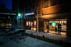 Starbucks custom-made illuminated channel letters with matching LED-lit sirens on a blade sign and window sign