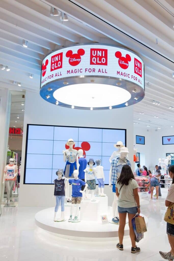 Uniqlo retail store interior with circular overhead branding and custom experiential signage by Gable