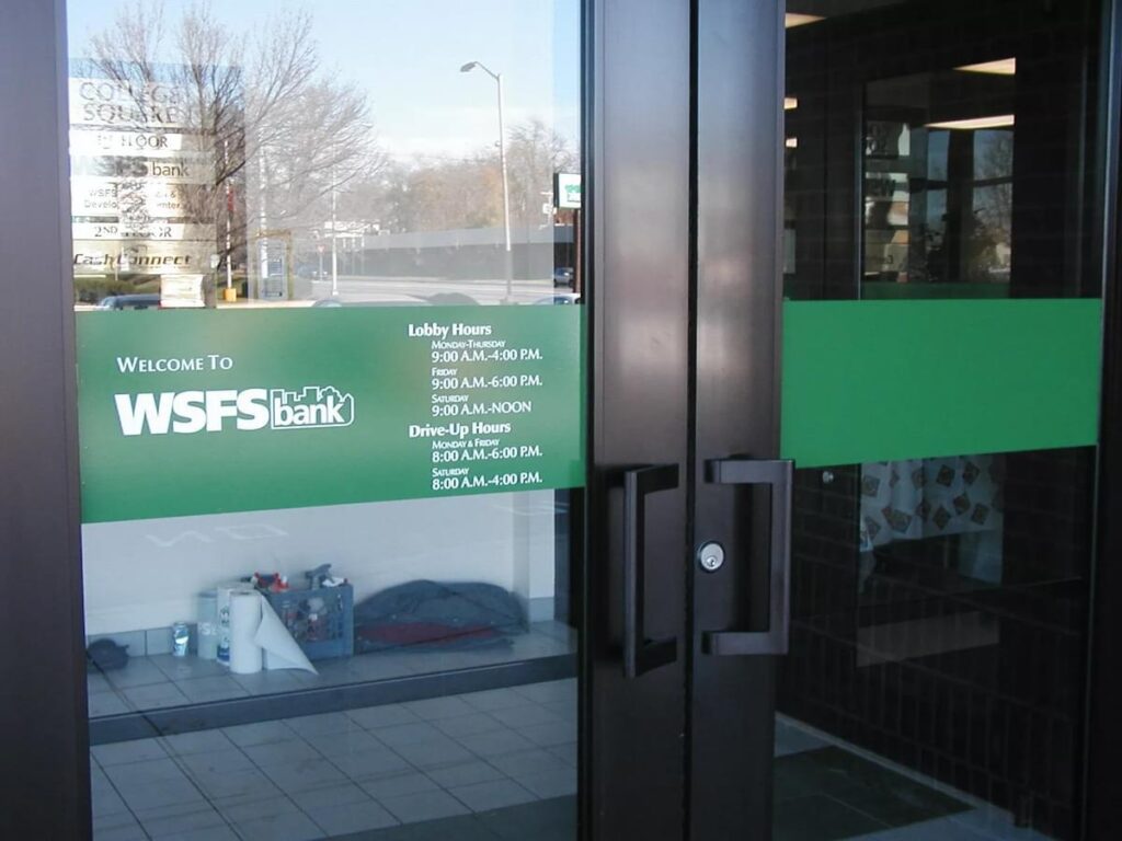 WSFS Bank entrance door graphics with branch hours and customer information signage by Gable.