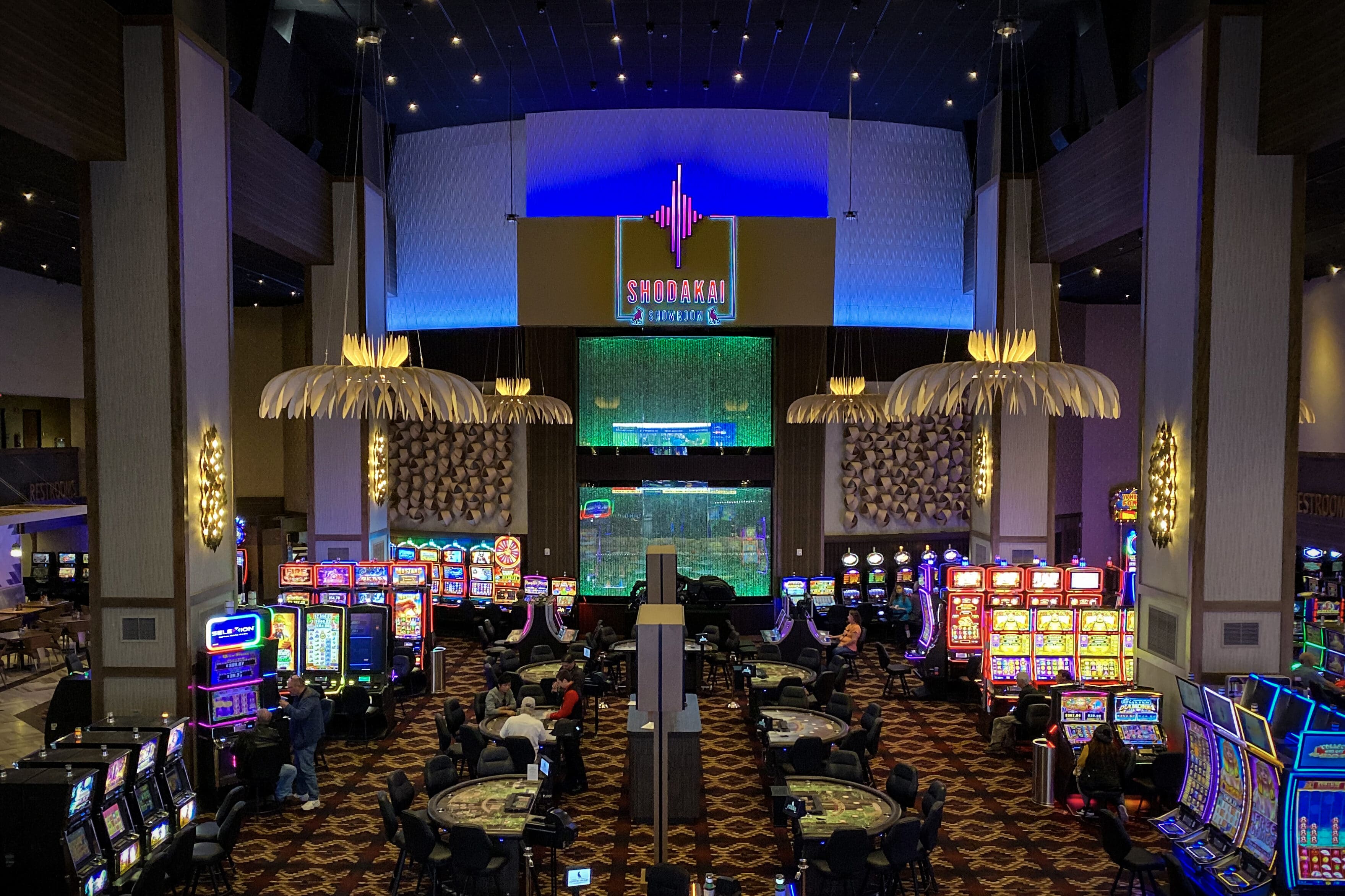 Casino gaming floor with illuminated architectural features and large-format interior branding by Gable.