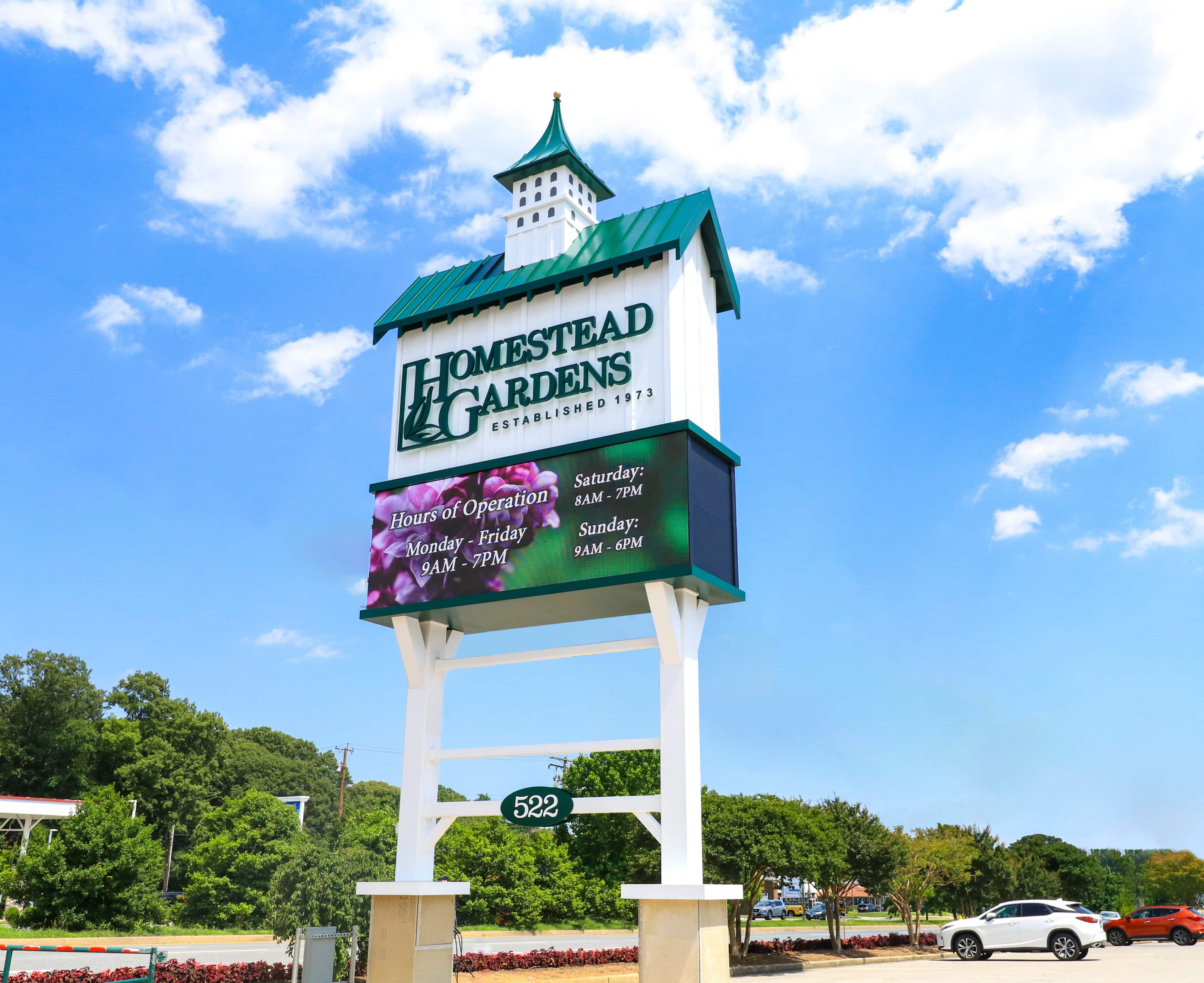Homestead Gardens freestanding pylon sign with digital message center and custom retail signage by Gable.