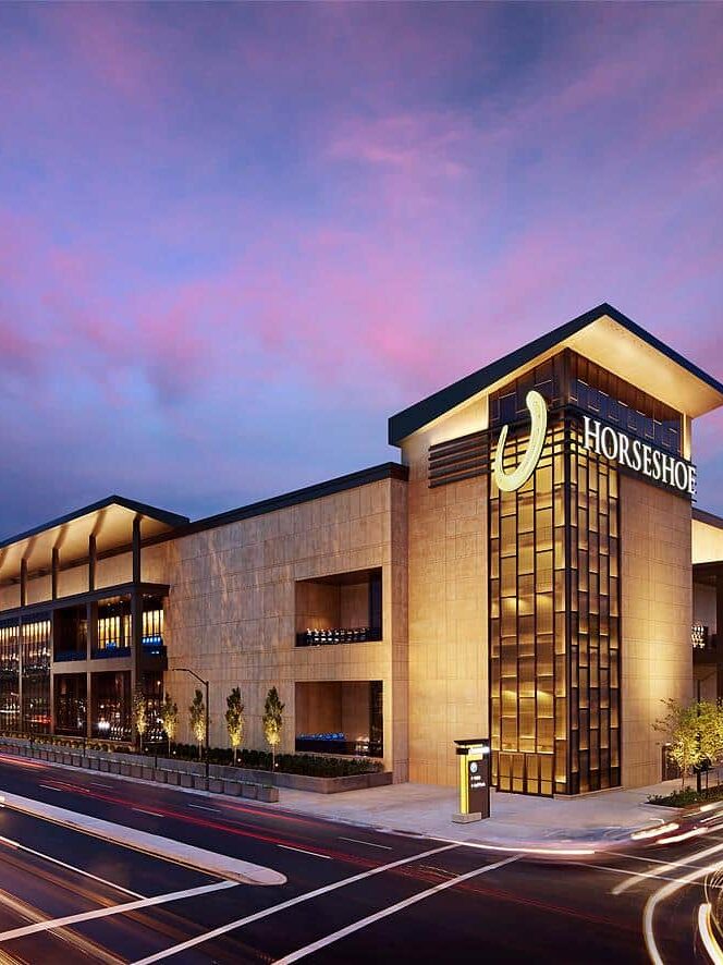 Horseshoe Casino exterior at dusk featuring custom building signage and architectural visual communications by Gable.