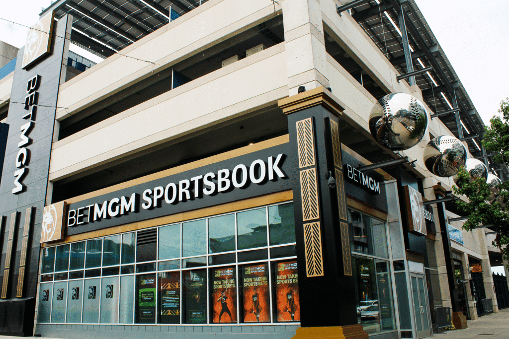 Exterior BetMGM Sportsbook illuminated channel letters, architectural accent panels, semi-transparent LED window mesh displays