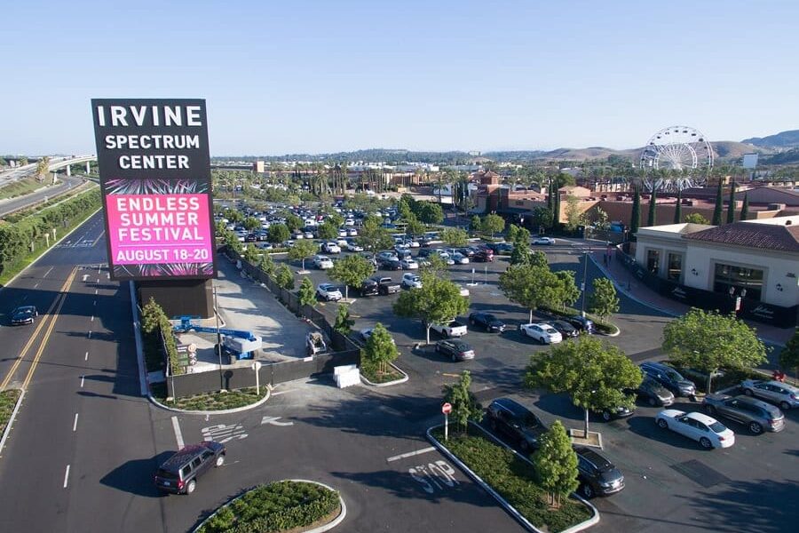 Irvine Spectrum Center roadside digital sign overlooking parking and retail district, installed by Gable.