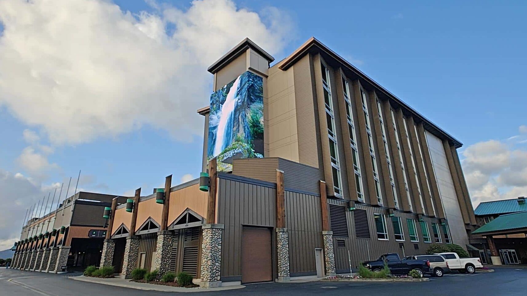 Ko-Kwel Casino Resort exterior featuring a large digital display mounted on the hotel tower.