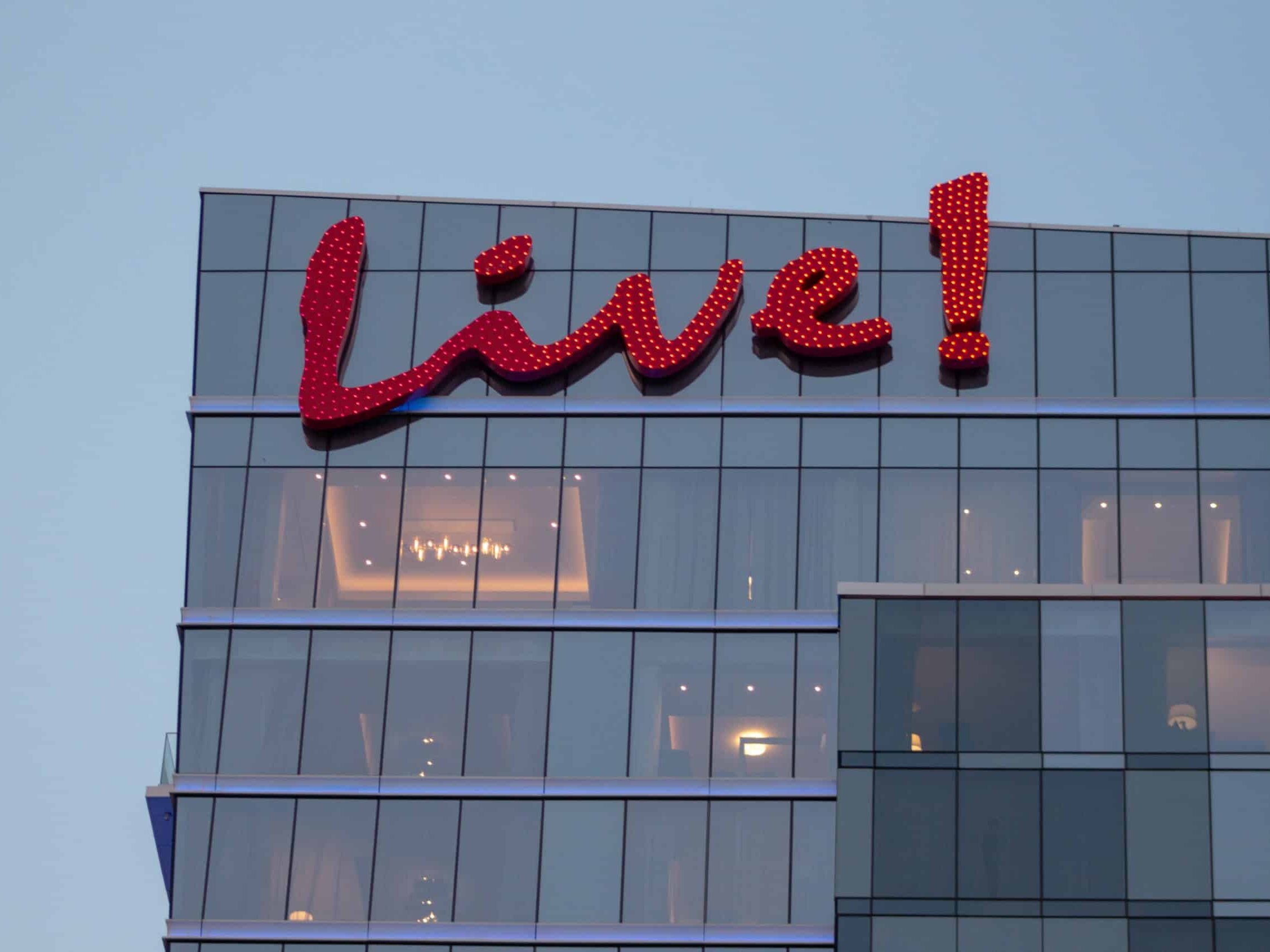 Live! script logo mounted on the hotel facade with custom hospitality signage by Gable.