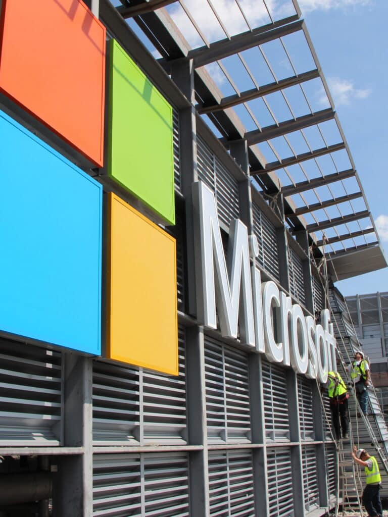 Close-up of Microsoft logo signage installation on a corporate office facade by Gable.