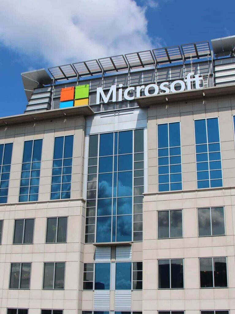 Microsoft headquarters-style exterior with prominent building-mounted logo signage and architectural branding by Gable.