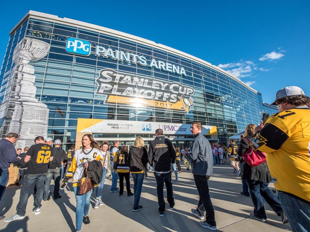 Arena entrance with large-scale event graphics and branded venue signage by Gable.