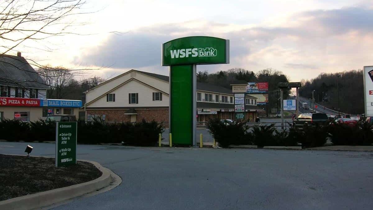 WSFS Bank roadside monument sign at dusk featuring branded exterior banking signage by Gable.