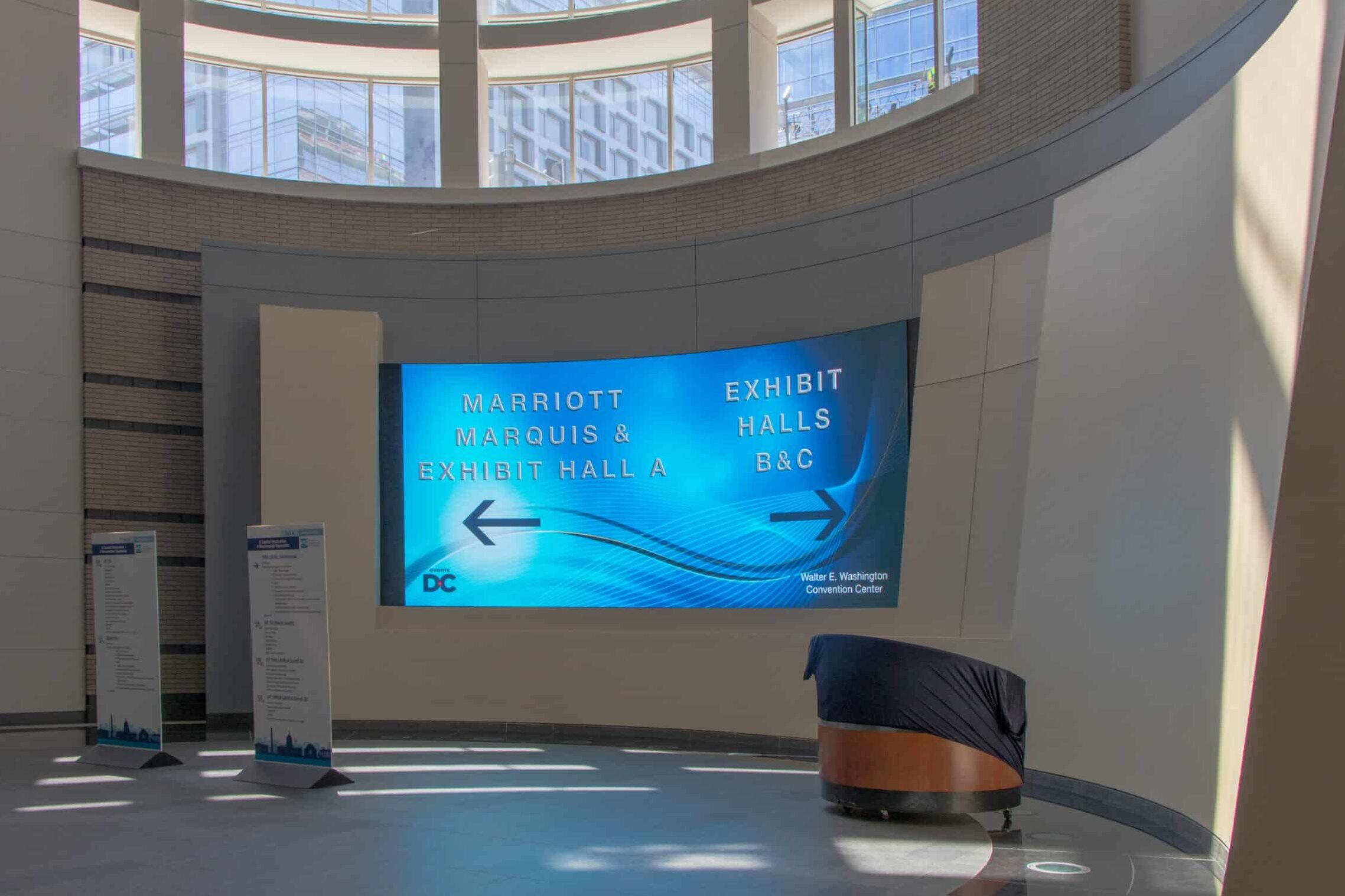 Digital directional display inside the Walter E. Washington Convention Center featuring event wayfinding by Gable.